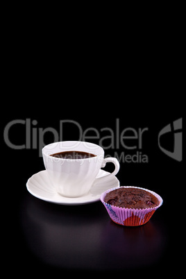 Hot cup of coffee and chocolate cherry muffin