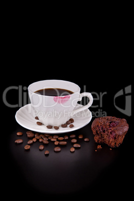 Hot coffee cup with red lipstick and muffin