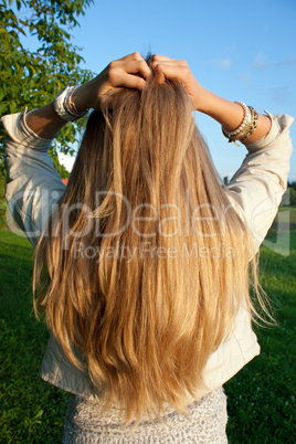 Young woman with helthy, long, blond hair