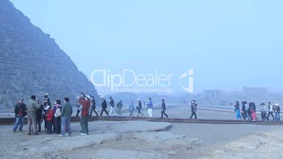 Tourists walking to the Pyramids of Giza, Cairo