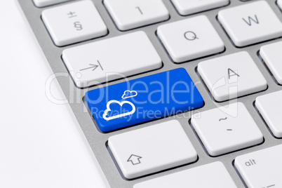 Keyboard with blue button showing cloud computing icon