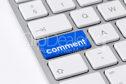 Keyboard with one blue button with the word "comment"