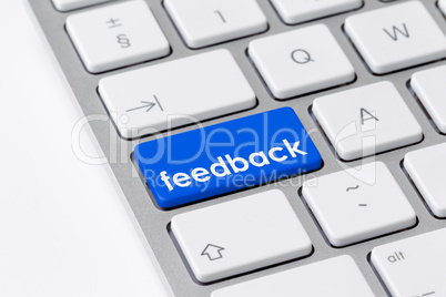 Keyboard with one blue button with the word "feedback"