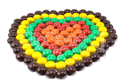 Sweets in multi-coloured chocolate glaze in the form of heart