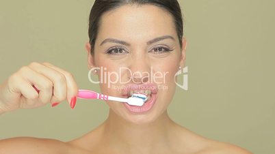 Smiling woman with toothbrush