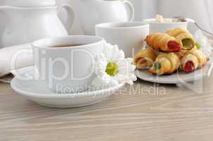 A cup of tea with homemade croissants