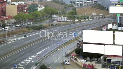 City timelapse with empty billboards on a highway.