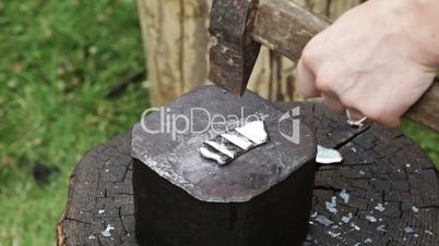 blacksmith forges iron