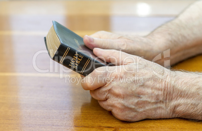 holding the bible