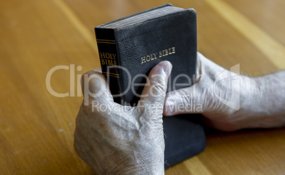 holding the bible