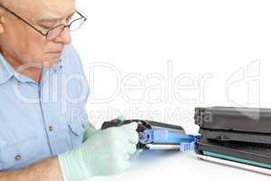 Man repairing toner cartridge