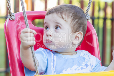 baby boy in swing