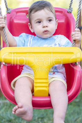 baby boy in swing