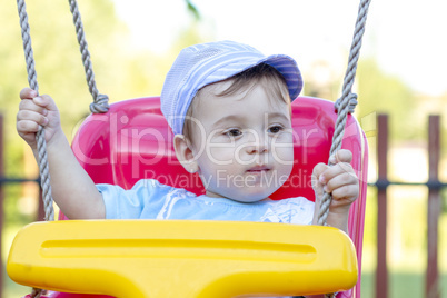 baby boy swinging