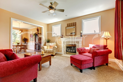 Beautiful peach and red liiving room interior with firepalce.