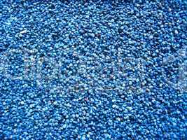 blue background from grains of a poppy