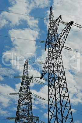 High voltage powerline over blue sky