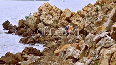 Fisherman in the coast. Pescador en la costa.