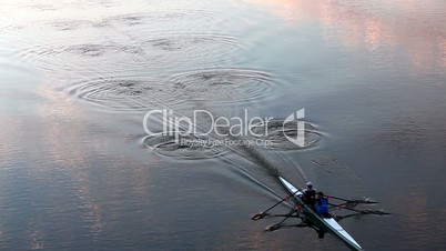 rowing at dusk - leaving wonderful waving pattern