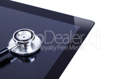 Digital tablet with stethoscope isolated on white