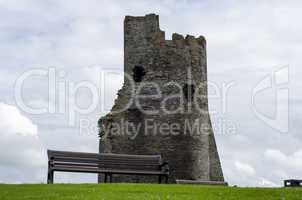 Empty Park Bench with Castle ruin in Background