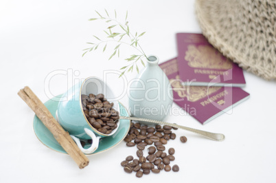 Coffee Cups and Coffee Beans with cinnamon and passports