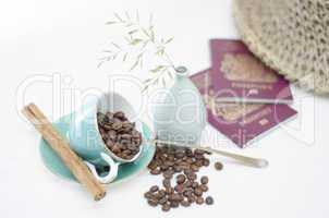 Coffee Cups and Coffee Beans with cinnamon and passports