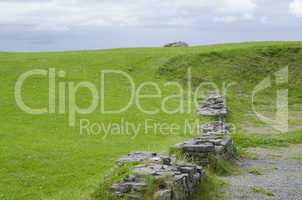 Castle Wall Disecting Bright Green Meadow