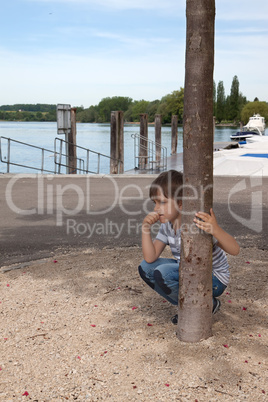 boy looks at the river