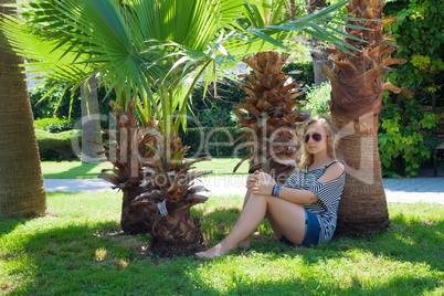 girl under a palm tree