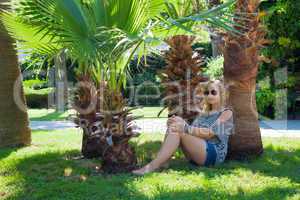 girl under a palm tree