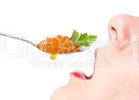 Woman eating caviar. Isolate on white background.