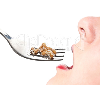 Woman eating sprouted grains.