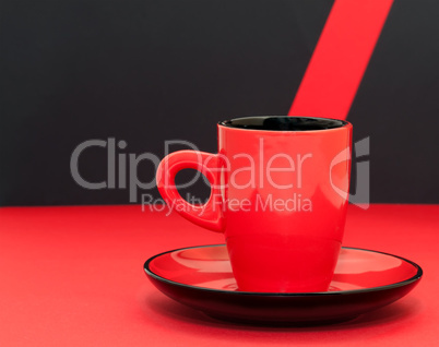 Red coffee cup on a black background