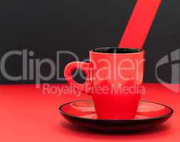 Red coffee cup on a black background