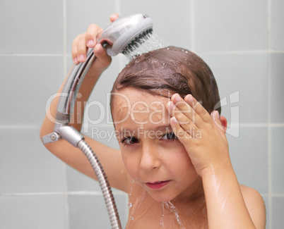 Little boy is bathed in the shower