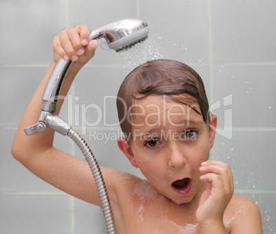 Little boy is bathed in the shower