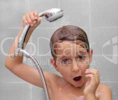 Little boy is bathed in the shower