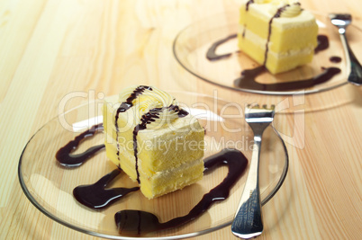 fresh cream cake closeup with chocolate sauce