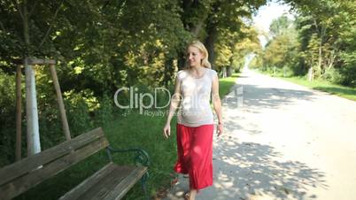 pregnant woman enjoying summer day