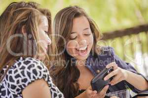 Mixed Race Girls Working on Electronic Devices