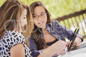 Mixed Race Girls Working Together on Tablet Computer