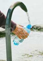 fountain of spring water bottle filling holding hand in Lugano,