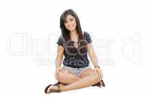 young girl sitting on a floor