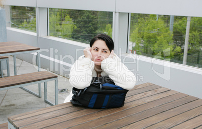 Outdoor portrait of a sad woman looking thoughtful about trouble