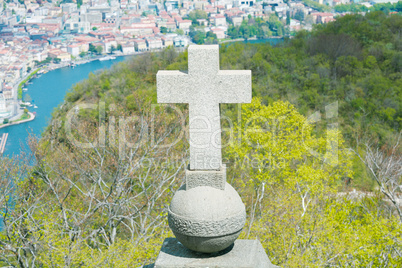 View of Lugano from San Salvatore mountain with a cross in front