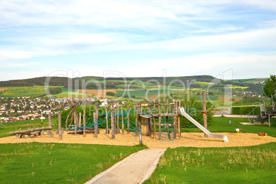 Children's play area outside, against the backdrop of the rural