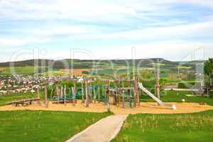 Children's play area outside, against the backdrop of the rural