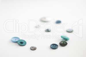 a spiral of blue -green recycled buttons