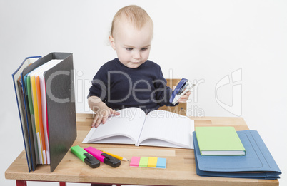 young child at writing desk